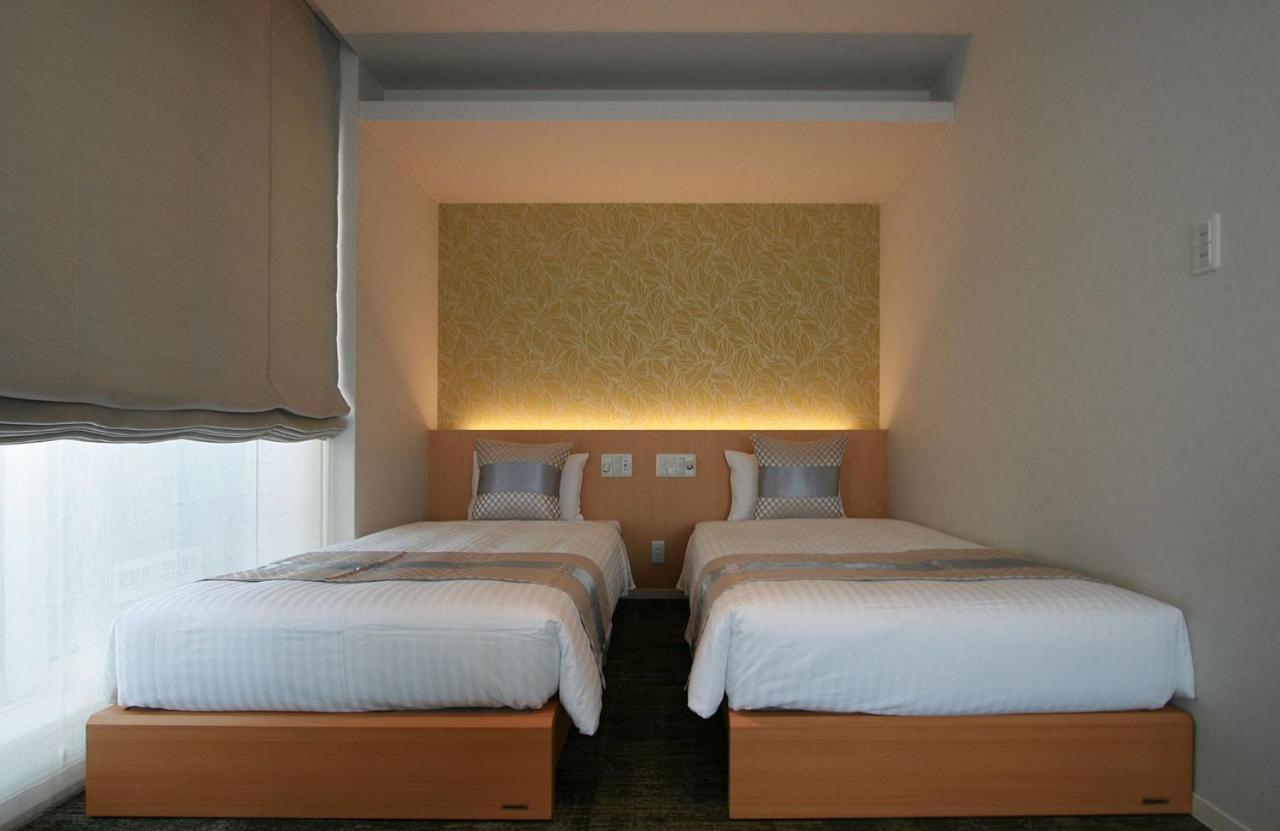 Grand Base Okayama Ekimae Aparthotel Екстериор снимка