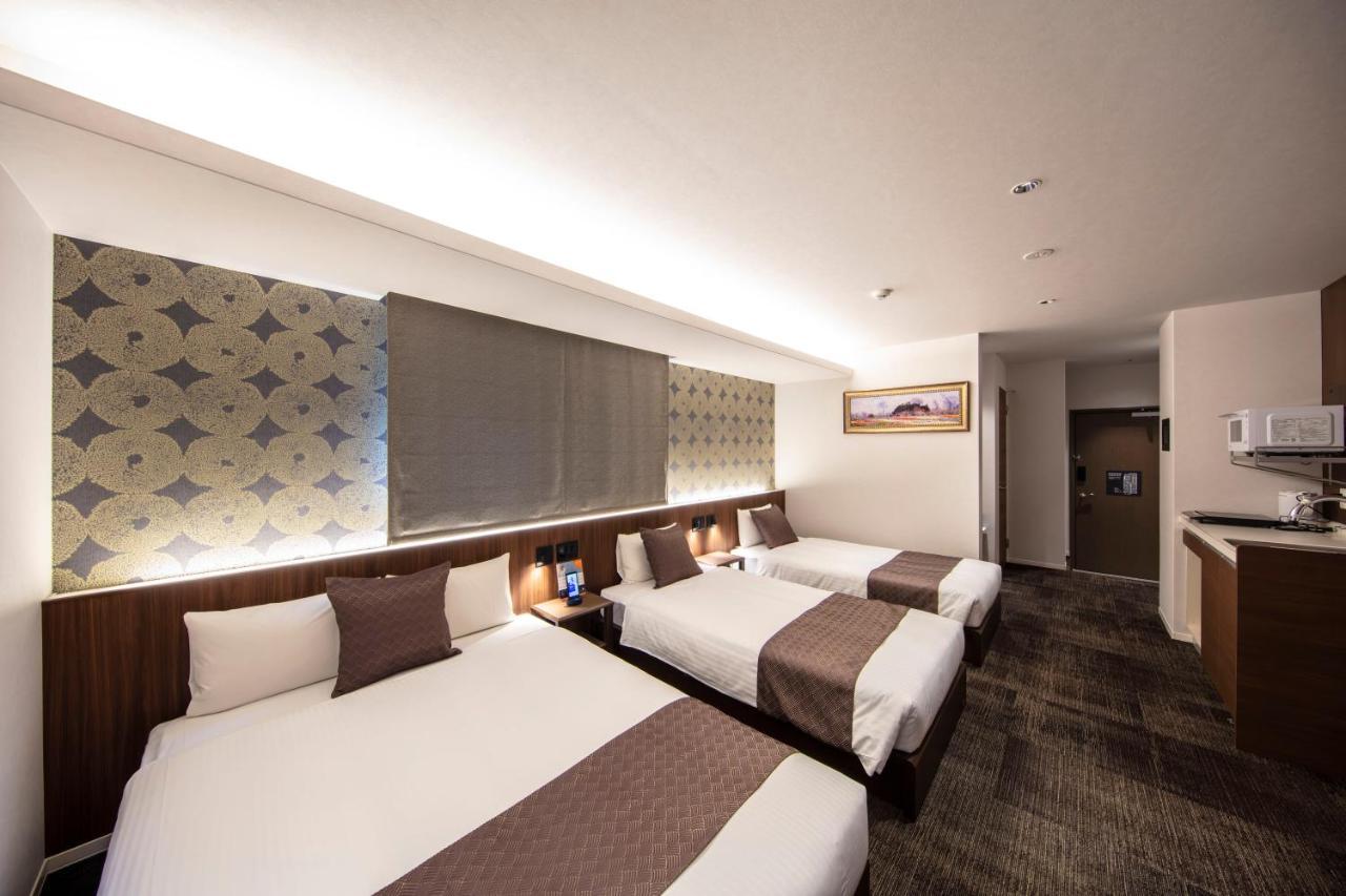 Grand Base Okayama Ekimae Aparthotel Екстериор снимка